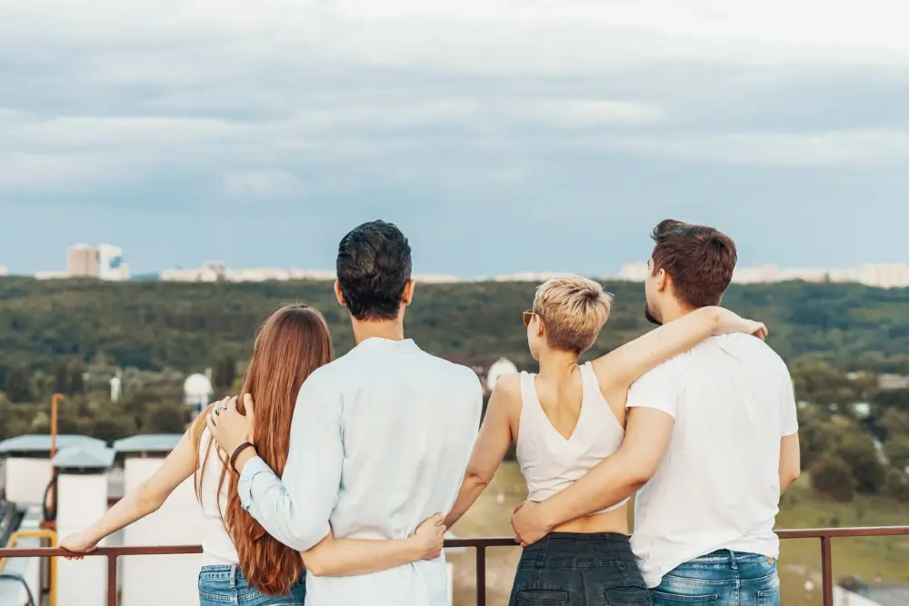 Group Friends Enjoying Outdoors Roof Scaled 1